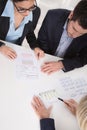 Business meeting. Three people sitting at the table in an office Royalty Free Stock Photo