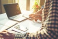 Business meeting time. Photo young account managers crew working with new startup project. Notebook on white table. Idea Royalty Free Stock Photo