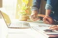 Business meeting time. Photo young account managers crew working with new startup project. Notebook on white table. Idea Royalty Free Stock Photo