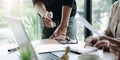 Business meeting time. Photo young account managers crew working with new startup project. Notebook on wood table. Idea Royalty Free Stock Photo