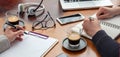 Man and woman work together on a wooden desk. Teamwork, modern business office, close up Royalty Free Stock Photo