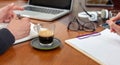 Man and woman work together on a wooden desk. Teamwork, modern business office, close up Royalty Free Stock Photo