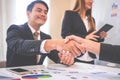 Business man gladly smile shaking hand with partner