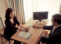 Business man handing pen to a woman for contract signing Royalty Free Stock Photo