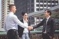 Business man with handshake with partner woman cheering Royalty Free Stock Photo