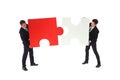 Business men holding two puzzles Royalty Free Stock Photo