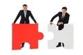 Business men holding two puzzles Royalty Free Stock Photo