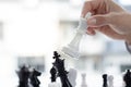 Business men make plans to play chess with Prudence and success