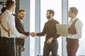 Business men shaking hands in office Royalty Free Stock Photo