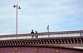 Business men walking across bridge