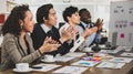 Business men and women of different nationalities were clapping their hands happily and smiling. In the meeting room at the office Royalty Free Stock Photo