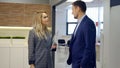 Business man and woman discussing a new agreement in the office Royalty Free Stock Photo