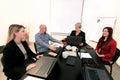 Business men and women at the meeting. Corporate group. Full concentration at work. Group of business people working. Royalty Free Stock Photo