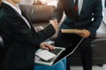 Business men and women shake hands confidently at office meeting. Royalty Free Stock Photo