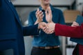 Business men and women shake hands confidently professional investor working with new startup project at an office meeting