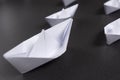 Business merge concept. An association. Origami paper ships. Royalty Free Stock Photo