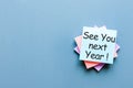 Business message See You Next Year written in message at blue table in background Royalty Free Stock Photo