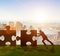 Business metaphor of teamwork with jigsaw puzzle Royalty Free Stock Photo