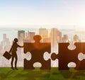 Business metaphor of teamwork with jigsaw puzzle Royalty Free Stock Photo