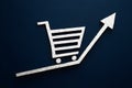 Business metrics on the move shopping cart logo accompanies upward graph