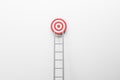Business mission, planning and goal concept with grey ladder and red and white target on abstract light wall background. 3D