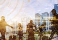 Business and modern technology concept. Double exposure of silhouetted people in city with wireless connection icons. Global
