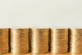 Business, Money, Finance, Security and Saving Concept. Close up of five stack of gold coins on wooden table with copy sapce