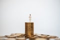 Business, Money Healthcare Concept. Docter miniature figure people standing on on top of stack and pile of gold coins white Royalty Free Stock Photo