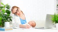 Business mother works at home via Internet with newborn baby Royalty Free Stock Photo
