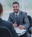 Business negotiations. Two businessmen talking in the office