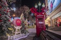 Business New Year decoration, purple red telephone booth with antler antlers and Christmas tree, night view