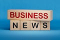 Business News symbol. Wooden blocks with words 'Business News'. Royalty Free Stock Photo