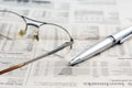Business newspaper and glasses Royalty Free Stock Photo