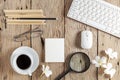 Business objects of keyboard,mouse,white coffee cup,white paper,pencils,glasses,magnifying glass and frangipani flowers on old Royalty Free Stock Photo