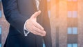 Business offer, partnership. Businessman holds out his hand