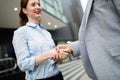 Business and office concept. Businessman and businesswoman shaking hands Royalty Free Stock Photo