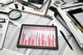Business office desk closeup - tablet computer with tables and graphs on the screen, financial reports, analysis and accounting,