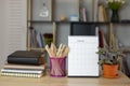 Business office desk with desktop carlendar, notebook, pencil and diary place on wooden table, working space at home. Business Royalty Free Stock Photo