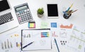 Business office desk with graph or annual report with laptop, pen calculator Royalty Free Stock Photo