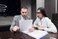 Business, office, law and legal concept - picture of man and woman hand signing contract paper Royalty Free Stock Photo