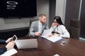 Business, office, law and legal concept - picture of man and woman hand signing contract paper Royalty Free Stock Photo