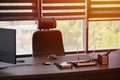 Business office workplace. Sunlight at work place for chief, boss or other employees. Table and comfortable chair. Light through Royalty Free Stock Photo