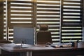 Business office workplace. Sunlight at work place for chief, boss or other employees. Table and comfortable chair. Light through Royalty Free Stock Photo