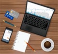 Business office workplace.Top view. Laptop with financial graph on screen, coffee cup, smartphone, credit cards,notepad Royalty Free Stock Photo