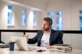 Business offices place. Angry Businessman working with laptop in office. Angry Business man director using laptop. Angry Royalty Free Stock Photo