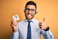 Business operator man with customer service headset from call center showing question mark happy with big smile doing ok sign, Royalty Free Stock Photo