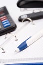 Business organizer, pen, calculator and stapler Royalty Free Stock Photo