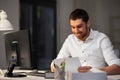 Businessman with computer working at night office Royalty Free Stock Photo