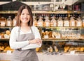 Business owner with bakery shop background