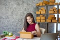 Business owner, Beautiful woman who works at home and pack your order to the customer, Smile happily
